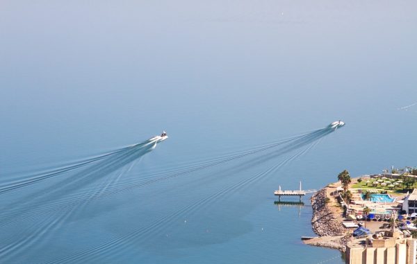 Sea of Galilee with calm blue waters and the Golan Heights rising in the background