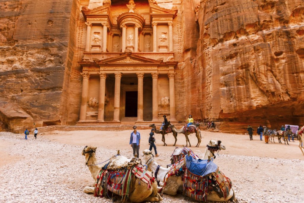 Ancient Petra with camels and tourists