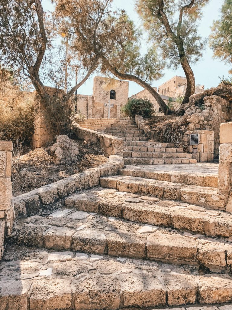 Jerusalem Half Day Tour walking through ancient stone alleys and stairs in the Old City of Jerusalem