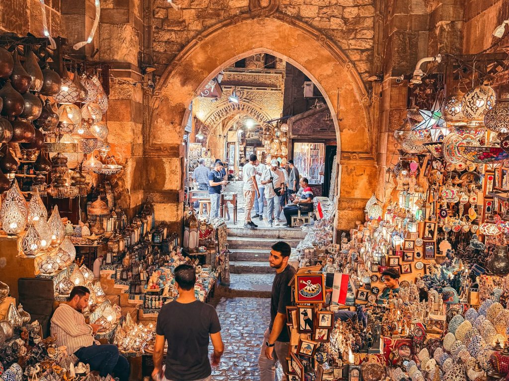Shoppers walking through the bustling Khan el-Khalili market in Cairo, Egypt