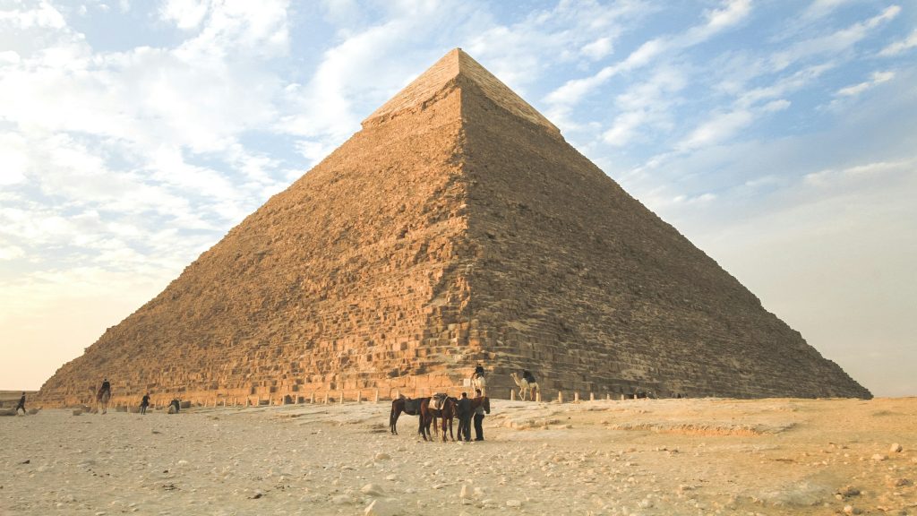 Cairo tour from Eilat travelers viewing the Pyramids of Giza rising from the desert in Egypt
