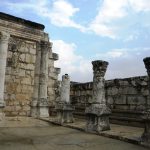 The white limestone ruins of the ancient synagogue at Capernaum on the shore of the Sea of Galilee in Israel