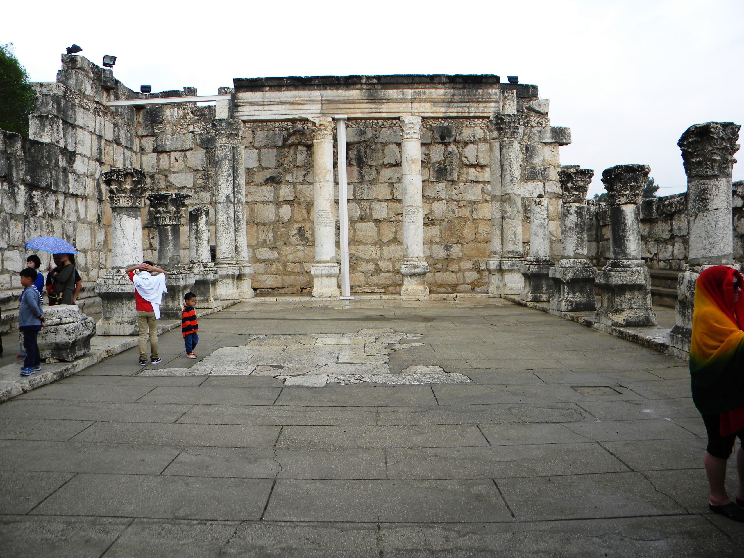 The white limestone ruins of the ancient synagogue at Capernaum on the shore of the Sea of Galilee in Israel