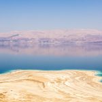 The turquoise water and mineral shore of the Dead Sea on a day trip in Israel
