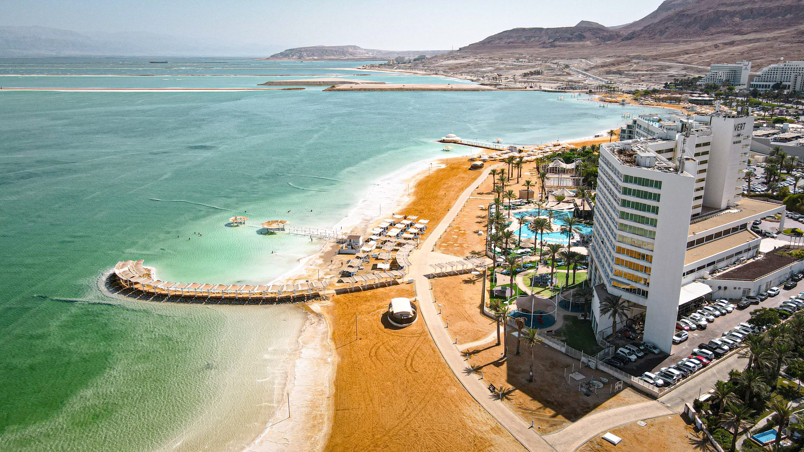 The clean public Dead Sea beaches promenade at Ein Bokek with shade shelters