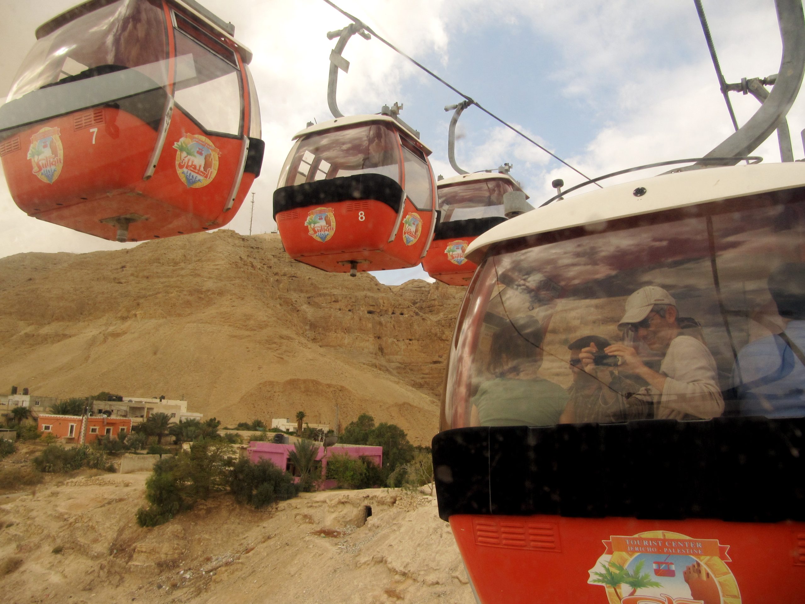 The Jericho cable car rising from the oasis town toward the Mount of Temptation monastery