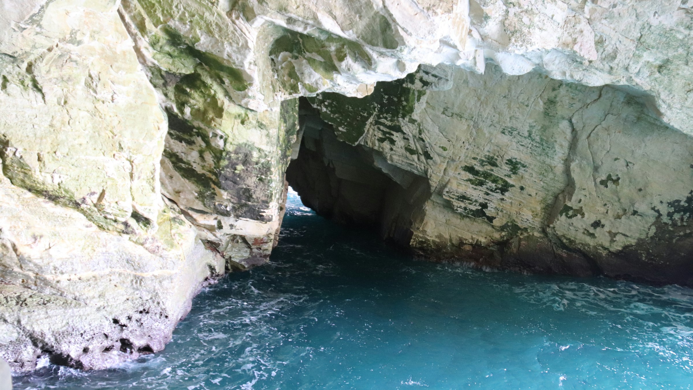 A blue grotto pool inside the sea caves of Rosh Hanikra in northern Israel