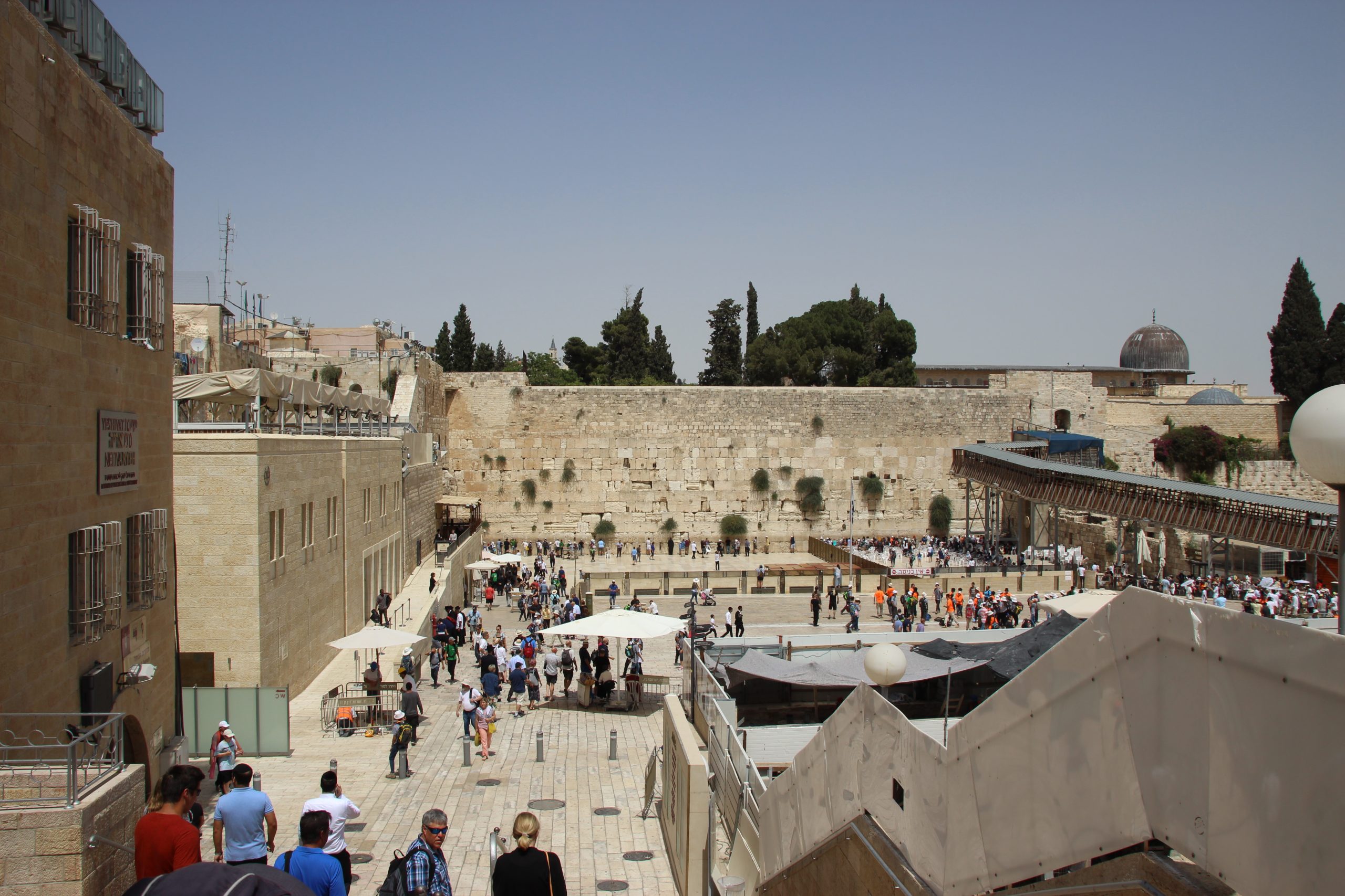 The Western Wall plaza in Jerusalem with worshippers at the men's and women's prayer sections